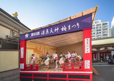 Group of people in front of building