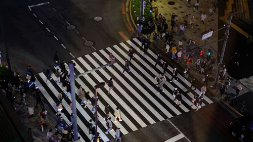 High angle view of people crossing road