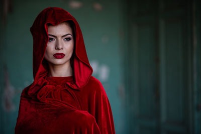 Portrait of beautiful young woman standing outdoors