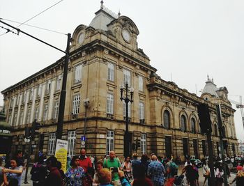 Group of people in front of building