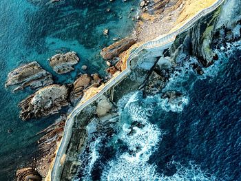 Seascape with stairs in ocean. 