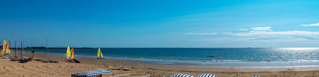 Scenic view of sea against blue sky