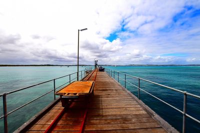 Pier over sea against sky