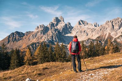 Rear view of man standing on mountain