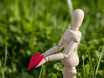 Close-up of stuffed toy on field