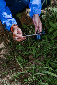 Low section of man working on field