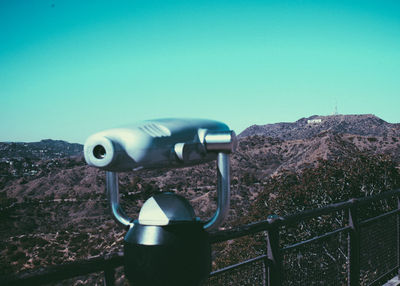 Close-up of coin-operated binoculars against clear sky