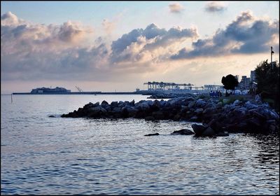 Scenic view of sea against cloudy sky