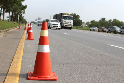 Traffic cones on road in city