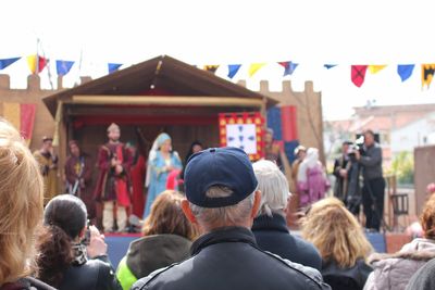 Group of people watching street show