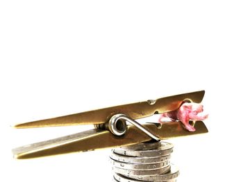 Close-up of coin-operated binoculars against white background