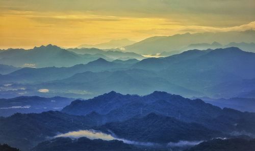 Scenic view of mountains against sky during sunset