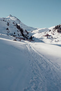 Scenic view of snow covered mountain against sky