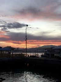 Scenic view of silhouette city against sky during sunset