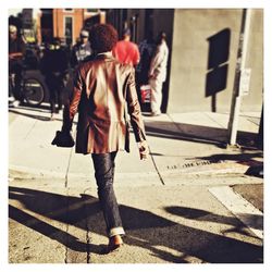 Woman walking on road