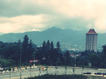 View of city against cloudy sky