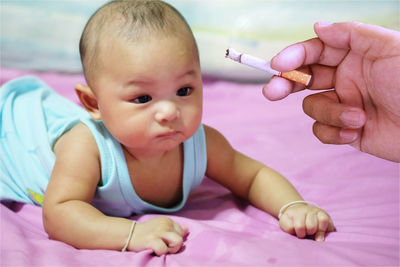 Midsection of woman holding baby boy