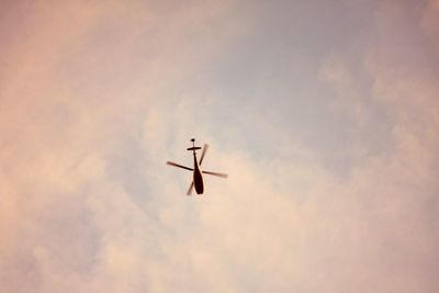 Low angle view of airplane in sky