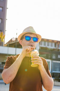 Midsection of man holding ice cream cone