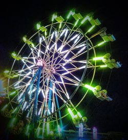 Low angle view of firework display at night