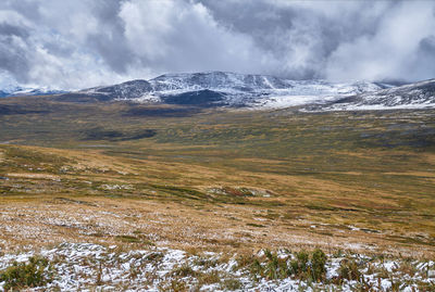 Scenic view of snowcapped mountains against sky