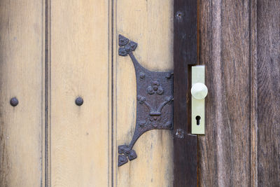 Close-up of closed old fashioned door entrance 