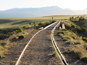 Dirt road passing through landscape