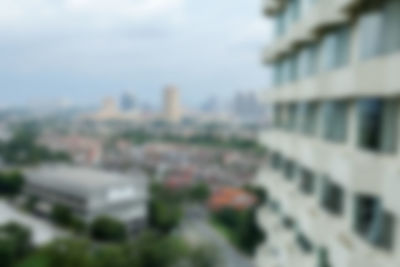 Tilt-shift image of building against sky