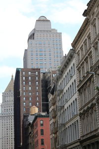 Low angle view of buildings in city against sky