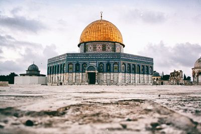 Exterior of mosque against sky in city