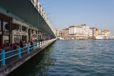 View of buildings in city against clear sky