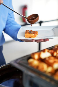 Waffles and chocolate drizzle food close-up