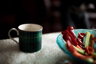 Close-up of coffee cup on table