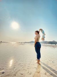 Full length of man on beach against sky