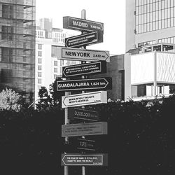 Low angle view of road sign against clear sky