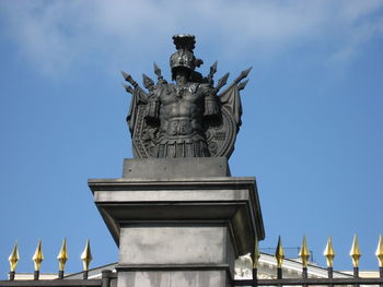 Low angle view of statue against cloudy sky