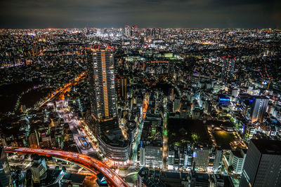 High angle view of illuminated cityscape at night