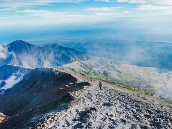 Aerial view of mountain range against sky
