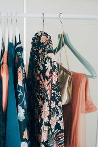 Close-up of clothes hanging on rack at home