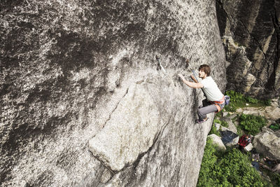 High angle view of man rock climbing