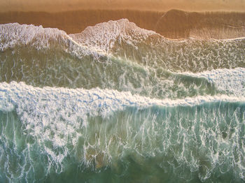 Close-up of waves rushing towards shore