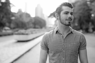 Portrait of young man standing outdoors