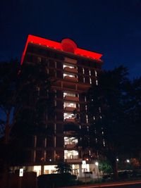 Low angle view of illuminated building at night