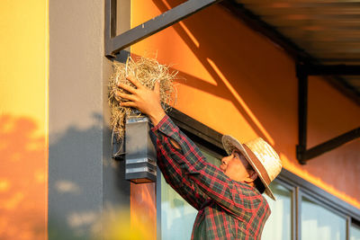 Rear view of woman using mobile phone