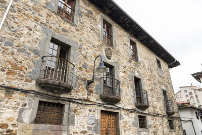 Low angle view of old building against sky