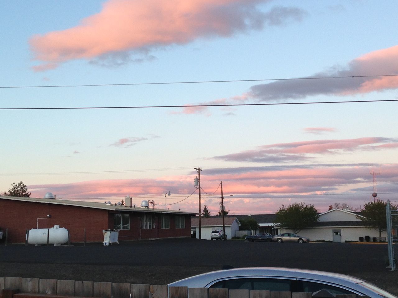 sunset, sky, architecture, built structure, cloud - sky, building exterior, orange color, power line, cloud, cloudy, cable, connection, electricity pylon, street light, residential building, city, outdoors, house, residential structure, no people