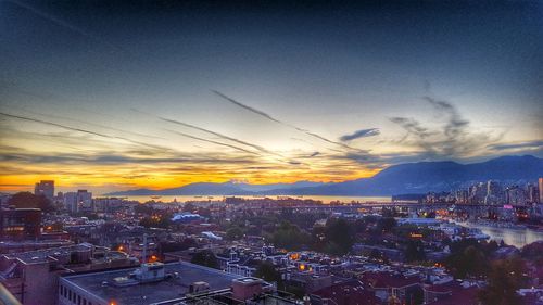 Aerial view of city at sunset