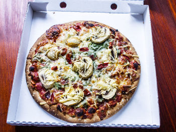 Close-up of pizza served on table