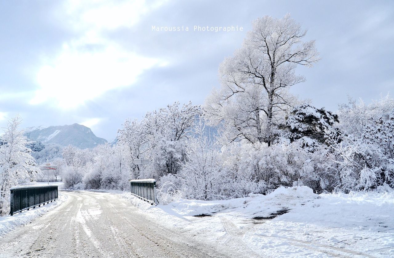 road, snow, transportation, winter, cold temperature, tranquil scene, the way forward, empty, scenics, sky, day, long, non-urban scene, mountain, snow covered, tranquility, nature, country road, outdoors, countryside, solitude, beauty in nature, remote, mountain range, diminishing perspective, curve