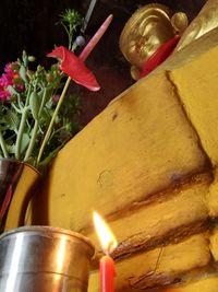 Close-up of lit candles on table